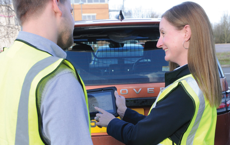 Man and woman looking at an ipad